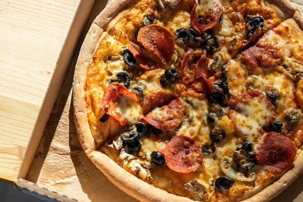 Foto ilustrativa de pizza para a Aproaut