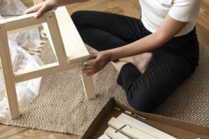 Woman assembling a diy chair from scratch